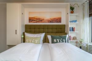 Postel nebo postele na pokoji v ubytování Haus Ornum, App SILD - 15 + 22 fotografií