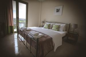 Postel nebo postele na pokoji v ubytování Hotel Marathia
