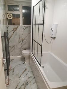 Ένα μπάνιο στο Cosy Apartment