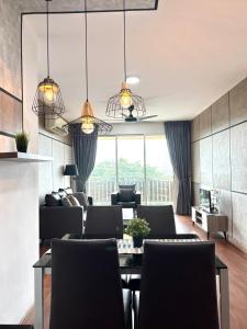 a living room with a table and chairs at KSL Premium-Style 3R3B 1-5Pax #Daya#Austin#Ikea in Johor Bahru