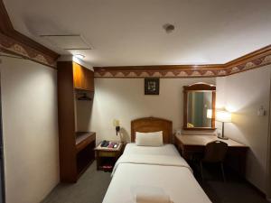 Postel nebo postele na pokoji v ubytování Hotel Deleeton
