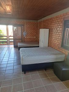 En eller flere senge i et værelse på Casa Fávero - Bairro Araça