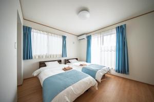 Ένα ή περισσότερα κρεβάτια σε δωμάτιο στο Inamine Terrace K