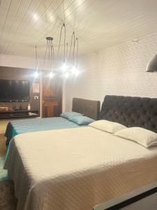 Postel nebo postele na pokoji v ubytování Quarto Aconchegante N 1
