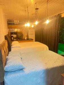 Postel nebo postele na pokoji v ubytování Quarto Aconchegante N 1