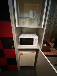 Kuchyň nebo kuchyňský kout v ubytování ホテルロサージュ