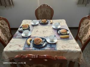 a table with plates of food on top at Kinmen Good Friends B&B in An-ch'ien