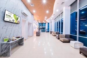 TV a/nebo společenská místnost v ubytování Whiz Prime Hotel Balikpapan