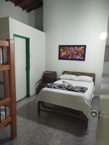 Letto o letti in una camera di Hotel Casa Verde Guatapé
