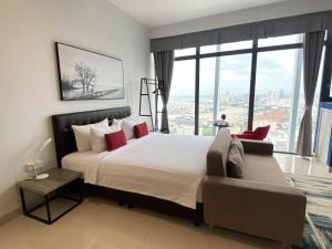 a bedroom with a large bed and a large window at The Bridge Club in Phnom Penh +136 photos