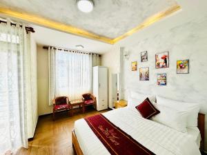 Postel nebo postele na pokoji v ubytování Dalat ECO Hotel 2