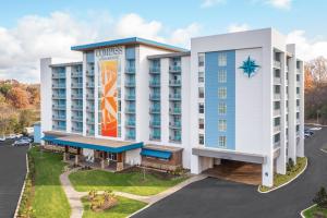 an image of the front of a hotel at Compass by Margaritaville Hotel Pigeon Forge in Pigeon Forge