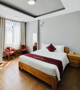 Postel nebo postele na pokoji v ubytování Dalat ECO Hotel 2
