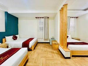 Postel nebo postele na pokoji v ubytování Dalat ECO Hotel 2