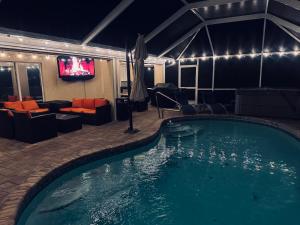The swimming pool at or close to Four Bedrooms Oasis with Heated Pool Private Jacuzzi and Billiards
