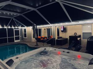 The swimming pool at or close to Four Bedrooms Oasis with Heated Pool Private Jacuzzi and Billiards