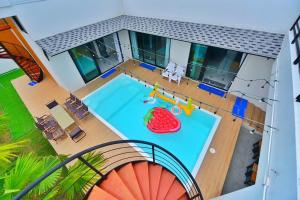 an aerial view of a house with a swimming pool at Level UP pool villa Rayong in Rayong