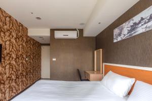 Postel nebo postele na pokoji v ubytování E Lim Hotel