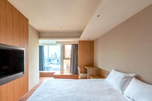 Postel nebo postele na pokoji v ubytování E Lim Hotel