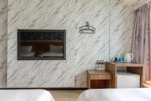 Postel nebo postele na pokoji v ubytování E Lim Hotel