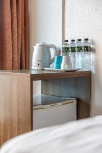 Postel nebo postele na pokoji v ubytování E Lim Hotel