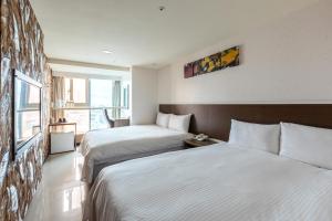 Postel nebo postele na pokoji v ubytování E Lim Hotel