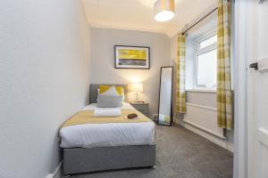 Postel nebo postele na pokoji v ubytování Taylor House, Durham