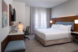 Ένα ή περισσότερα κρεβάτια σε δωμάτιο στο EVEN Hotel Bozeman Yellowstone Intl Arpt by IHG
