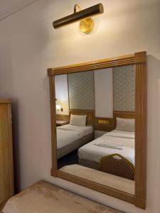 Postel nebo postele na pokoji v ubytování Hotel Deleeton