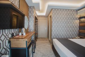 A bed or beds in a room at Prusias Otel
