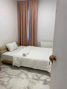 Postel nebo postele na pokoji v ubytování HOTEL YEDİkapı