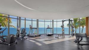a gym with a view of the ocean at Apartemen IDR Borneo Bay in Klandasan Kecil