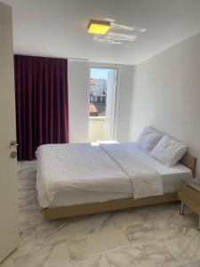 Postel nebo postele na pokoji v ubytování HOTEL YEDİkapı