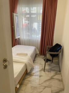 Postel nebo postele na pokoji v ubytování HOTEL YEDİkapı