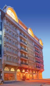 a large white building with a lot of windows at Marmaray Hotel in Istanbul