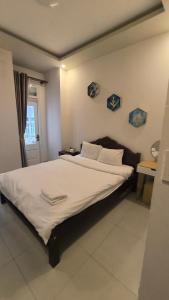 Postel nebo postele na pokoji v ubytování Conico Hotel at Dalat