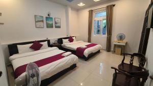 Postel nebo postele na pokoji v ubytování Conico Hotel at Dalat