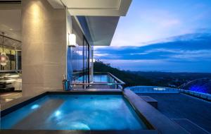 a swimming pool on top of a building at Renaissance Bali Uluwatu Resort & Spa in Uluwatu