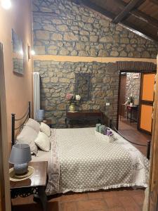 Postel nebo postele na pokoji v ubytování Agriturismo Le Grotte
