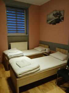 Postel nebo postele na pokoji v ubytování Dom Brama Mazur