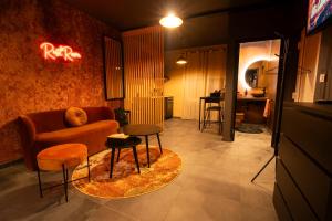a living room with a couch and a table at Spa Rust Room in Berstett