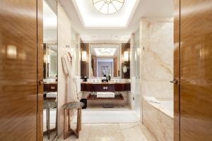 a bathroom with a large mirror and a sink at The Ritz-Carlton, Chengdu in Chengdu