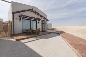 a house in the middle of the desert at Sugardunes Beach Resort in Ghadw
