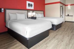 Voodi või voodid majutusasutuse Ramada by Wyndham Parsippany toas