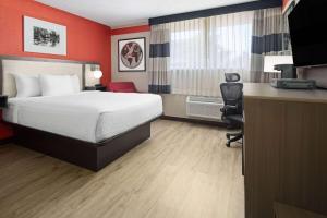 Voodi või voodid majutusasutuse Ramada by Wyndham Parsippany toas