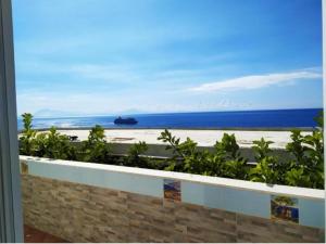 a view of the beach from a balcony at Casa Emi in Amalfi +4 photos