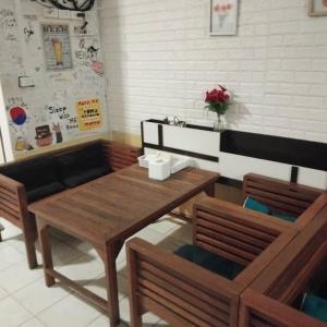 a dining room with a table and two chairs at amazing khaosan hostel in Bangkok
