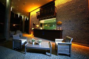 a lobby with chairs and a table and a counter at Costa Farilya Special Class Hotel Bodrum in Gundogan