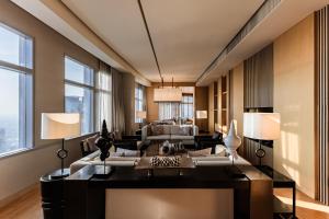 a living room with a couch and a table at Bangkok Marriott Hotel Sukhumvit in Bangkok