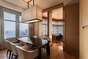 a dining room with a table and chairs at Bangkok Marriott Hotel Sukhumvit in Bangkok